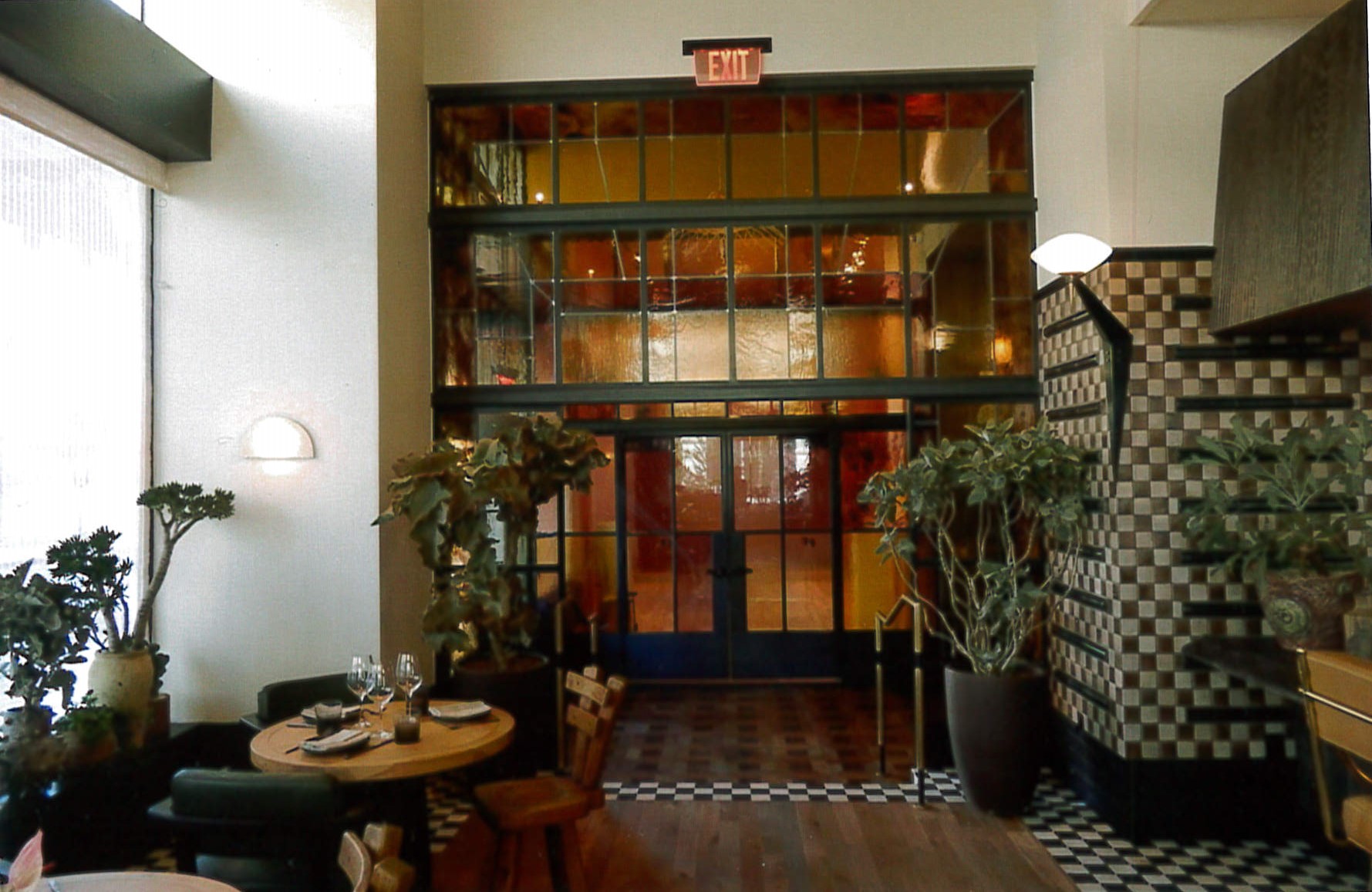 Alternate view of first floor restaurant leading to secondary entrance, new glass wall 